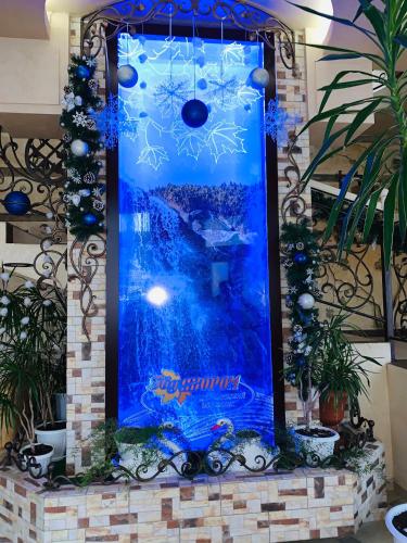a christmas display in a fireplace with blue decorations at Pid Yavorom in Ivano-Frankivsʼk