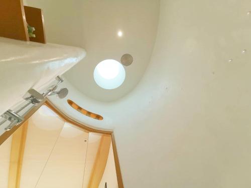 a bathroom with a sink and a white ceiling at Pannana Cha-am in Cha Am