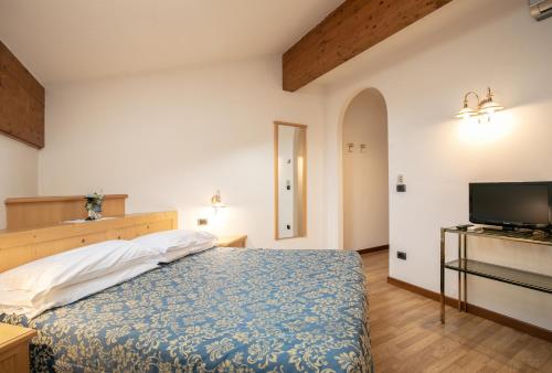Postel nebo postele na pokoji v ubytování Albergo Conca Verde