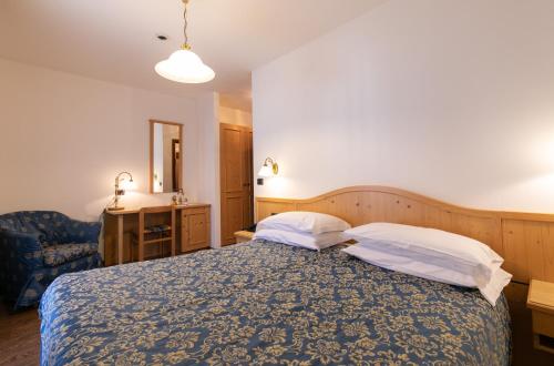 Cama o camas de una habitación en Albergo Conca Verde