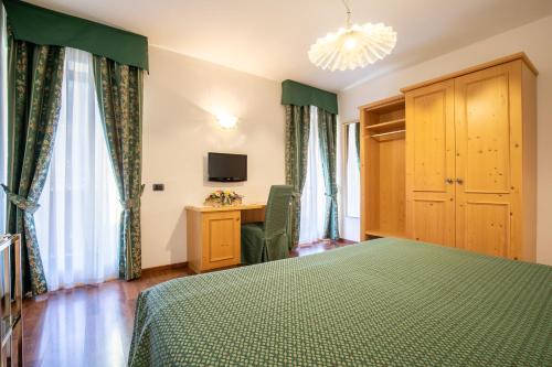 Cama o camas de una habitación en Albergo Conca Verde