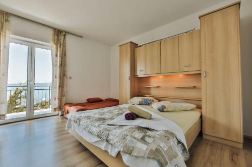 Katil atau katil-katil dalam bilik di Apartments Mateo