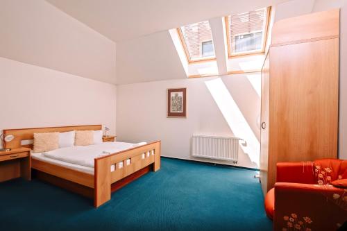 Postel nebo postele na pokoji v ubytování K-Triumf Resort