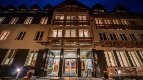 a building with a store in front of it at Gronie Ski & Bike in Szczyrk