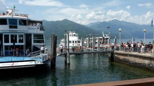 a group of people on a boat at a dock at Vesna Loft in Luino in Luino