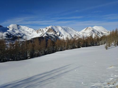 a snow covered mountain range with mountains in the background at Alpenlandhof in Bad Kleinkirchheim