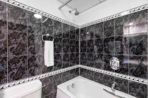 Ванная комната в Cedar Court Hotel Harrogate