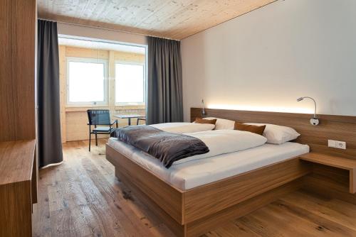 Postel nebo postele na pokoji v ubytování Rössle Appartements