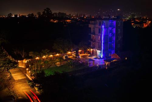 a building with blue lights on it at night at HOTEL Dadu in Batumi