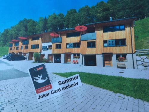 a building with a sign in front of it at Chalet Ablon in Saalbach Hinterglemm
