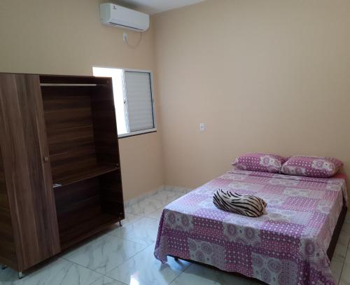 Ένα ή περισσότερα κρεβάτια σε δωμάτιο στο Atlantico Residencial