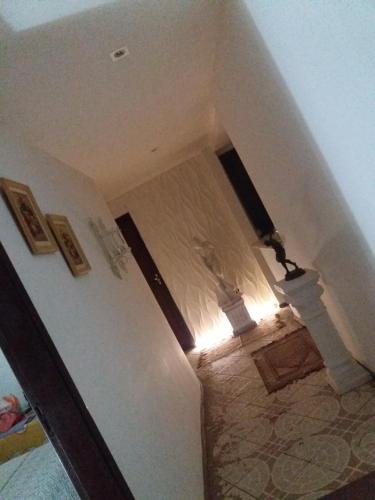 a view of a room with a hallway with a ceiling at CASACOMPART itapuã in Salvador
