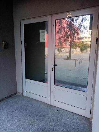 a door with a window in a building at FLAMANITA APARTMENTS in Skopje