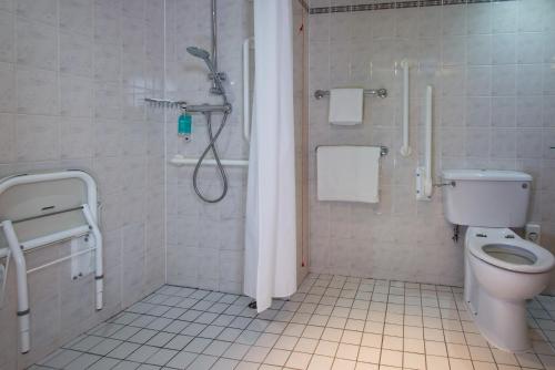 a bathroom with a shower and a toilet at Holiday Inn Express Bristol City Centre by IHG in Bristol