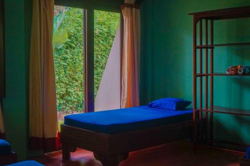 Cama o camas de una habitación en Hospedaje el Bosquecito