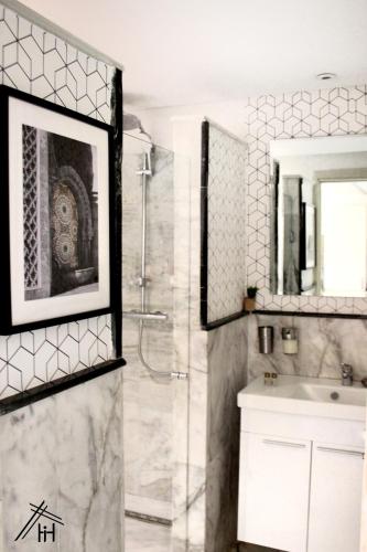 a bathroom with a shower and a sink at AiM HOUSE in Marrakech