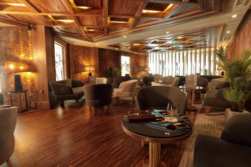 a restaurant with chairs and tables in a room at Le Palace d'Anfa in Casablanca