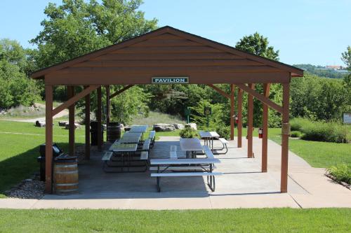 a pavilion with tables and benches in a park at Westgate Branson Woods Resort in Branson
