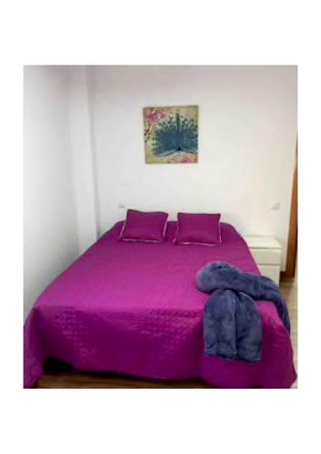 Un ou plusieurs lits dans un hébergement de l'établissement Apartamentos cerca del Aeropuerto