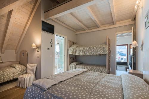 a bedroom with two beds and a window at Locanda Zita in Sestola
