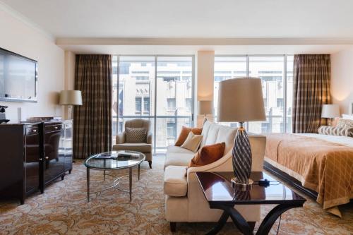 a hotel room with a bed and a couch at Taj Hotel Cape Town - Taj Residence suites in Cape Town