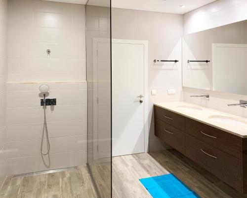 a bathroom with a shower and a sink at Holiday Apartment Ocean View in Ribeira Brava