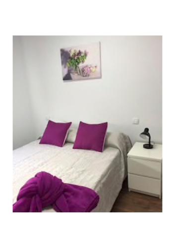 Un ou plusieurs lits dans un hébergement de l'établissement Apartamentos cerca del Aeropuerto