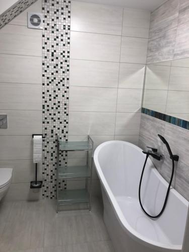 Kúpeľňa v ubytovaní Apartament Huzar