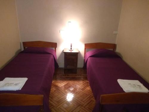 Ένα ή περισσότερα κρεβάτια σε δωμάτιο στο Hotel El Pibe