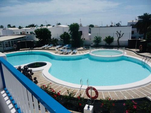 a large swimming pool on top of a building at Forever Views in Puerto del Carmen
