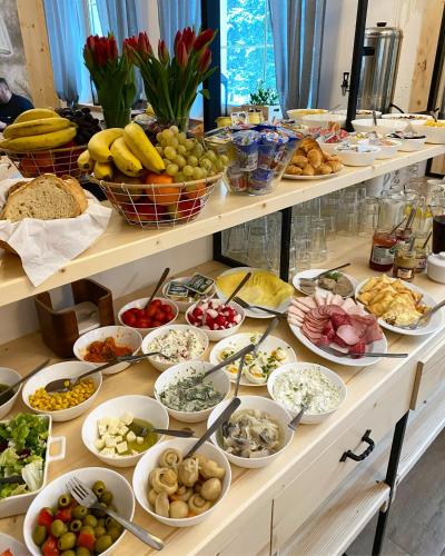 a buffet filled with lots of different types of food at Rezydencja Kojsowka in Witów