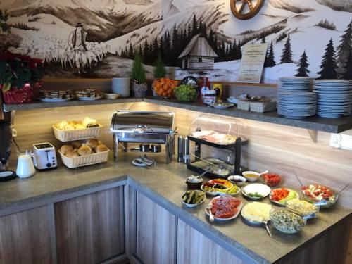 a buffet line with many different types of food at Pokoje Gościnne Kornelia- Jacuzzi, sauna ! in Biały Dunajec