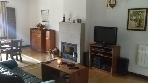 TV a/nebo společenská místnost v ubytování Casa Maria Joana