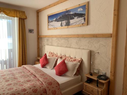 Postel nebo postele na pokoji v ubytování Hotel Lavaredo