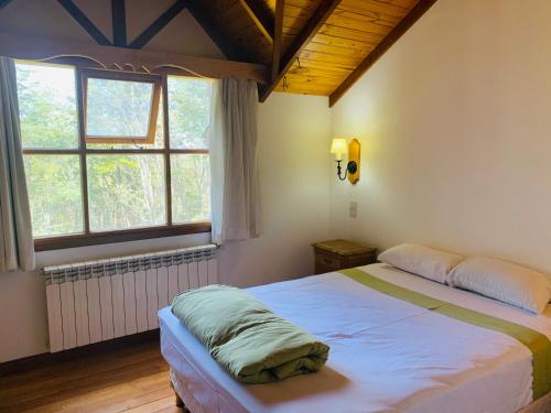 Ένα ή περισσότερα κρεβάτια σε δωμάτιο στο Casa en Ushuaia