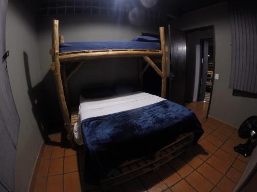 a couple of bunk beds in a room at Down The River Hostel in Iporanga