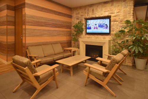 ドーミーインPREMIUM札幌にあるテレビまたはエンターテインメントセンター