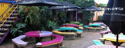 a group of tables and chairs with umbrellas at Moruya Monarch Hotel in Moruya