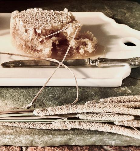 a plate with a piece of cake and a knife at La Saracina in Pienza