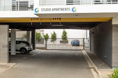a parking garage with a car parked under it at Mawson Lakes Hotel in Adelaide