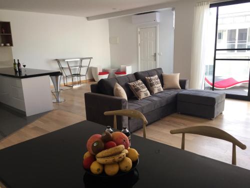 a living room with a couch and a table at Apartments in Phillip Island Towers - Block C in Cowes