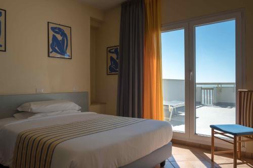 Postel nebo postele na pokoji v ubytování Hotel Ping Pong