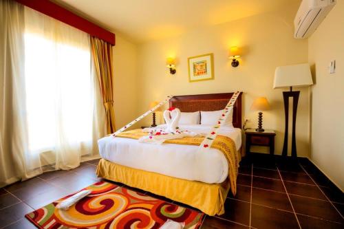 Ένα ή περισσότερα κρεβάτια σε δωμάτιο στο Porto South Beach by Amer Group - Families only
