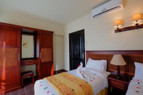 Katil atau katil-katil dalam bilik di Porto South Beach by Amer Group - Families only