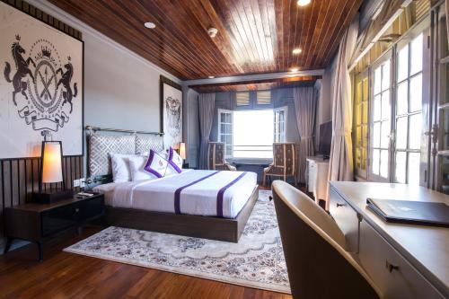 Postel nebo postele na pokoji v ubytování TTC Hotel - Ngoc Lan
