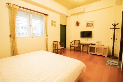 Una televisión o centro de entretenimiento en Wenxin Homestay