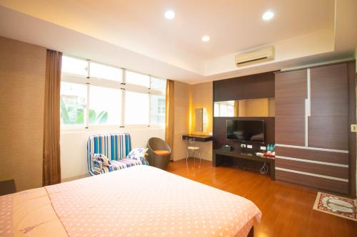 Un pat sau paturi într-o cameră la Wenxin Homestay