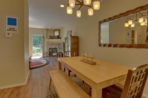 a dining room with a table and a mirror at Collins Lake #112 in Government Camp