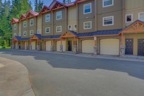 a large building with two garage doors on a street at Collins Lake #112 in Government Camp