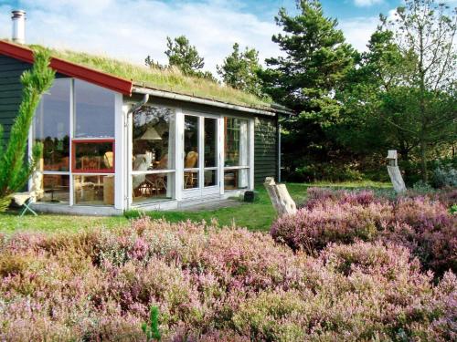 a small house with a grass roof at 6 person holiday home in R m in Bolilmark